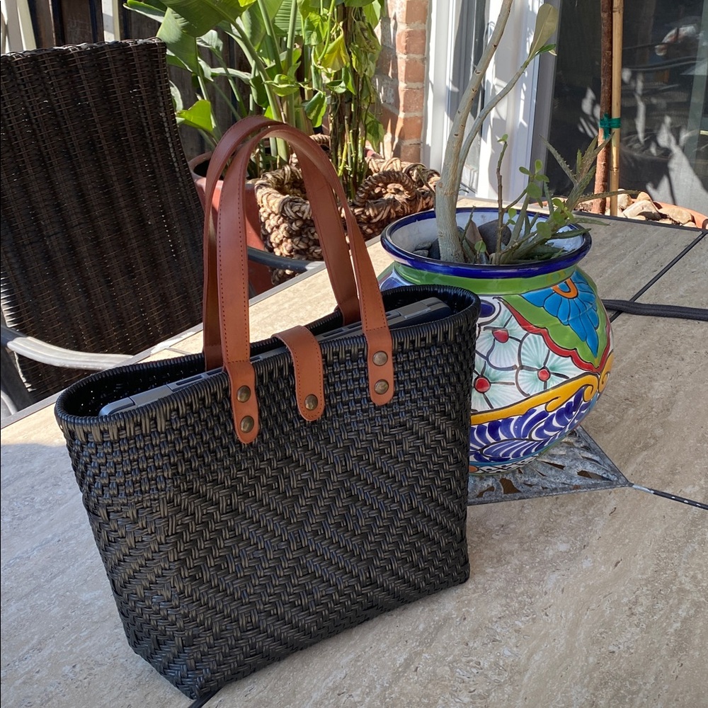 Artesian Black Woven bag with Brown leather handles. It’s beautiful